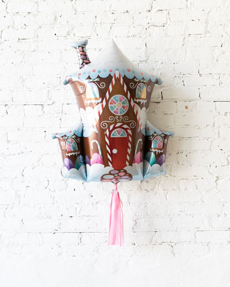 37in Gingerbread House Foil Balloon with Pink Skirt | Rental