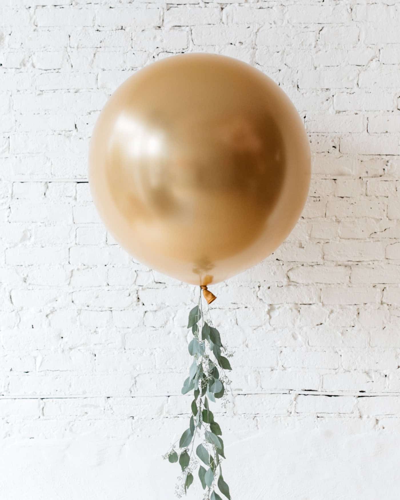 Brass Gold Giant Balloon and Eucalyptus Tassel | Rental